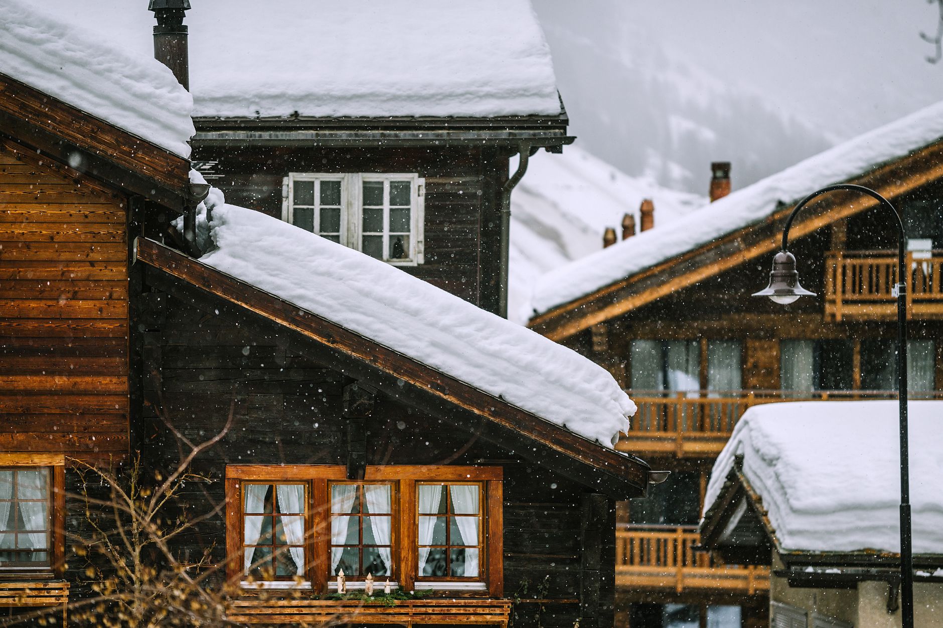 Timber alpine hermitage amidst Dolomites peaks